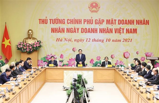 Business community’s trust, consensus demonstrate Government’s responsibility: PM hinh anh 2